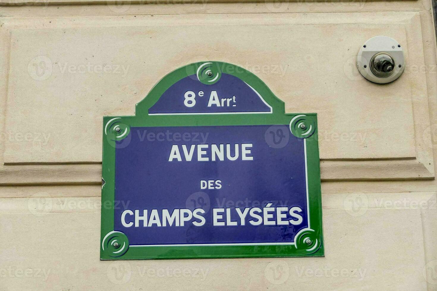 a sign on a building that reads avenue de champs elysees photo