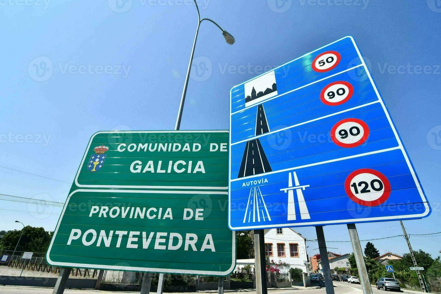 a street sign with the words galicia and pontevedra photo