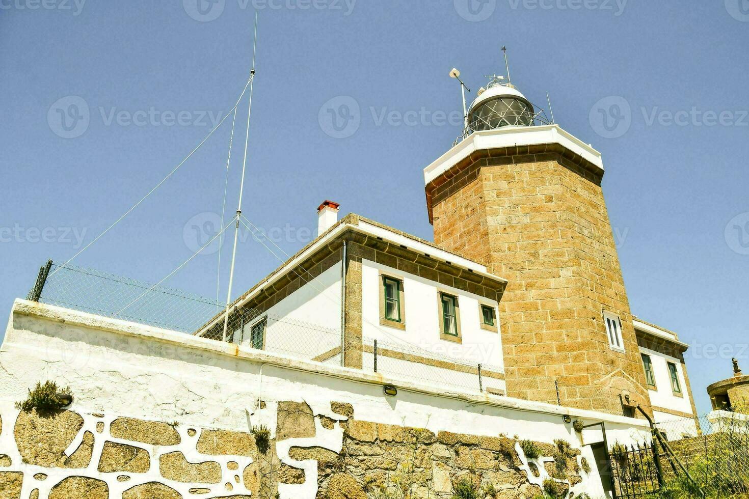 a red brick lighthouse photo