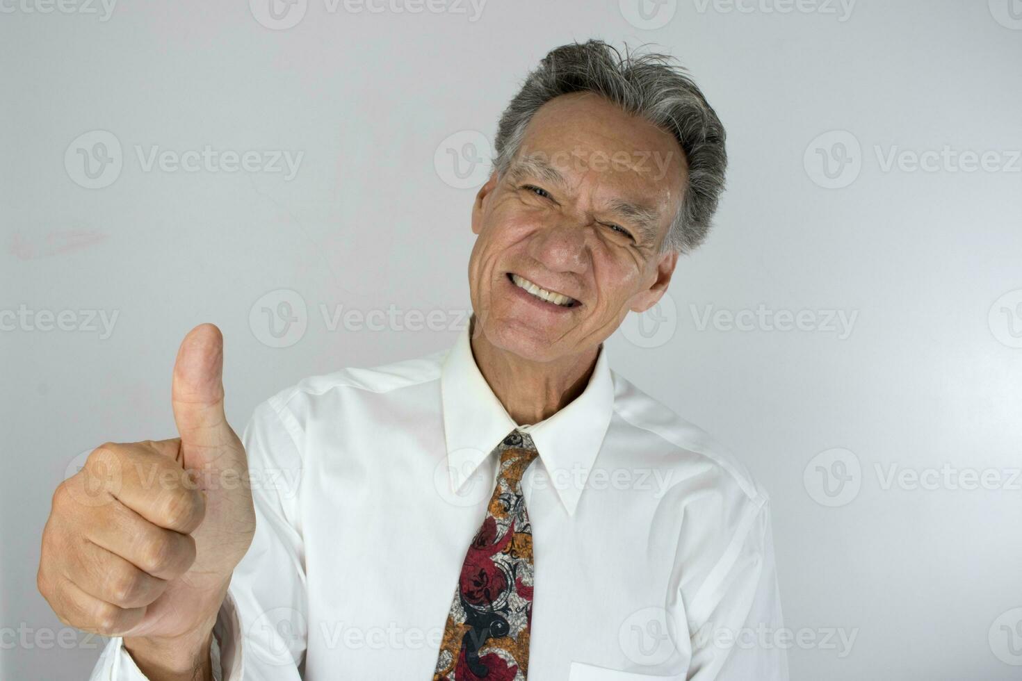 Senior Business Man CEO giving a thumbs up for a job well done photo