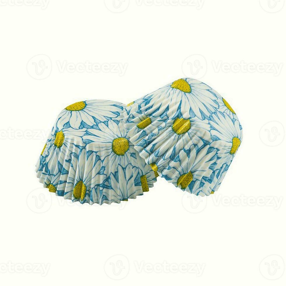 White paper baking forms for muffins and cupcakes with daisy flowers pattern photo