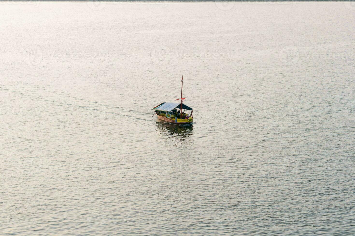 Aerial view of sailboat in windy condition. Sailing boat in the sea photo