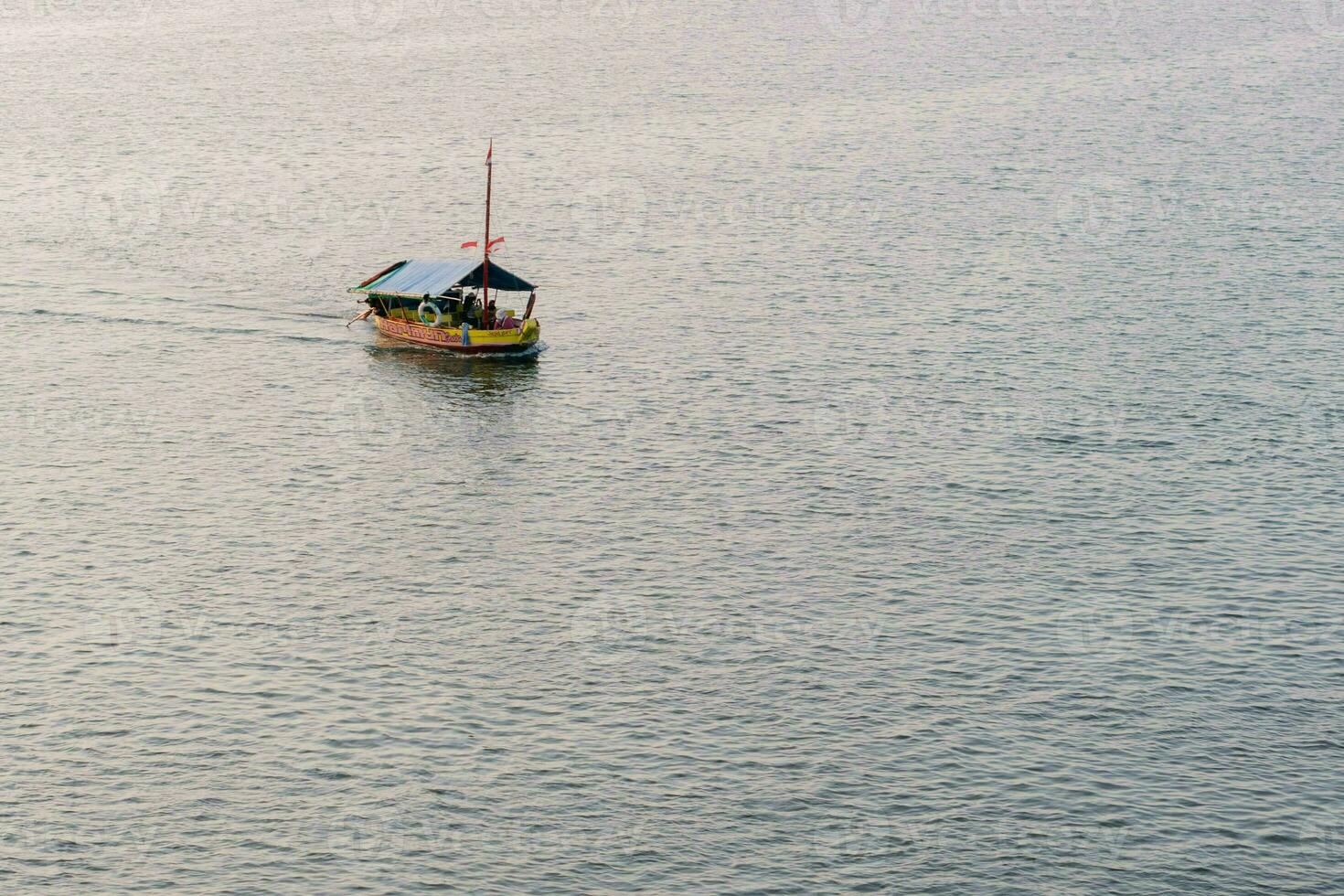 Aerial view of sailboat in windy condition. Sailing boat in the sea photo