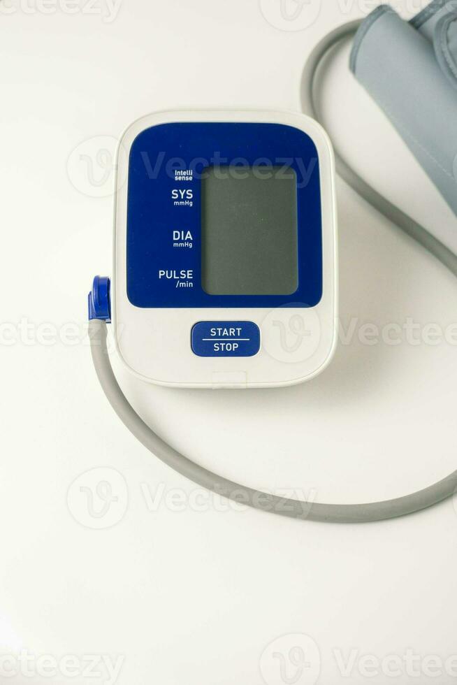 Automatic portable blood pressure machine with arm cuff isolated on white with copy space, studio shot. tonometer, hospital, research photo