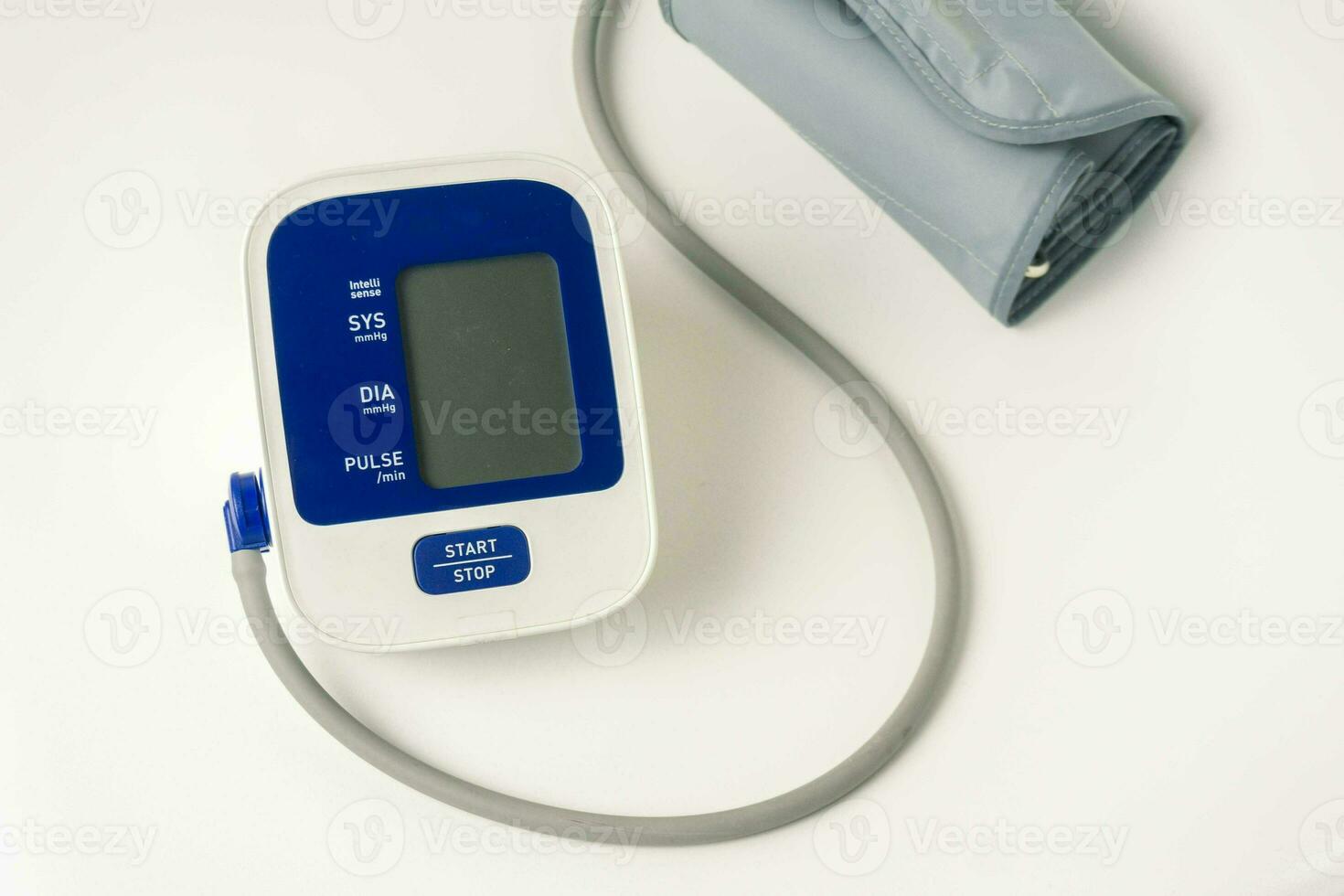 Automatic portable blood pressure machine with arm cuff isolated on white with copy space, studio shot. tonometer, hospital, research photo