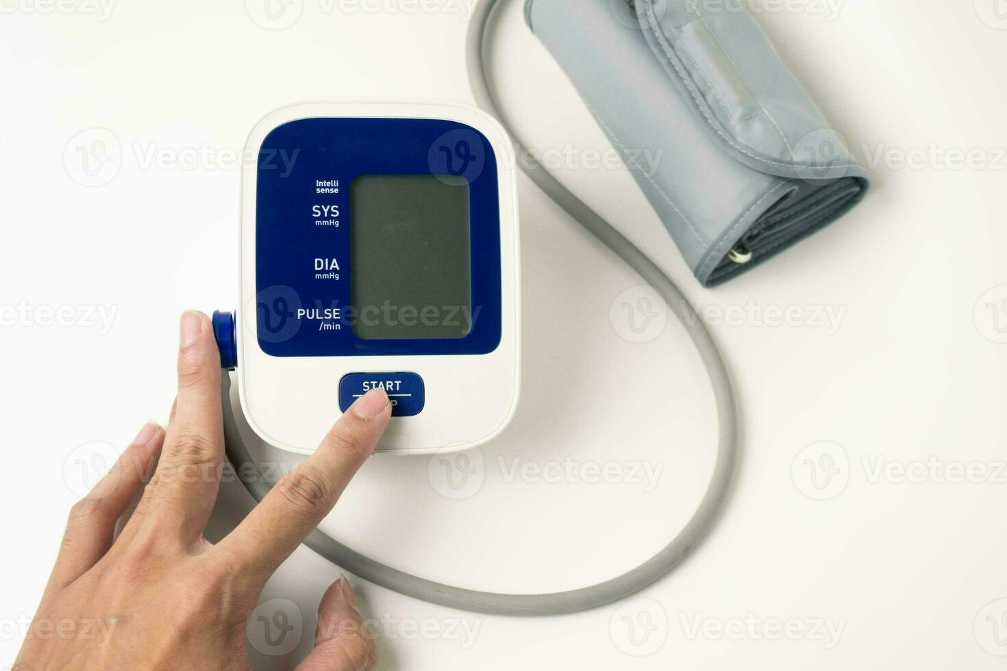 female hands check blood pressure monitor and heart rate monitor with digital manometer, isolated white background, healthcare and medical concept photo