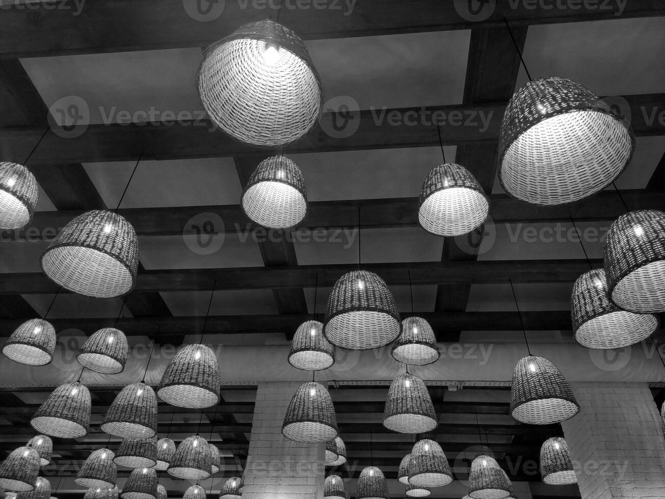 Black and white electric lamps and wooden ceiling background. Monochrome cafe photo wallpaper