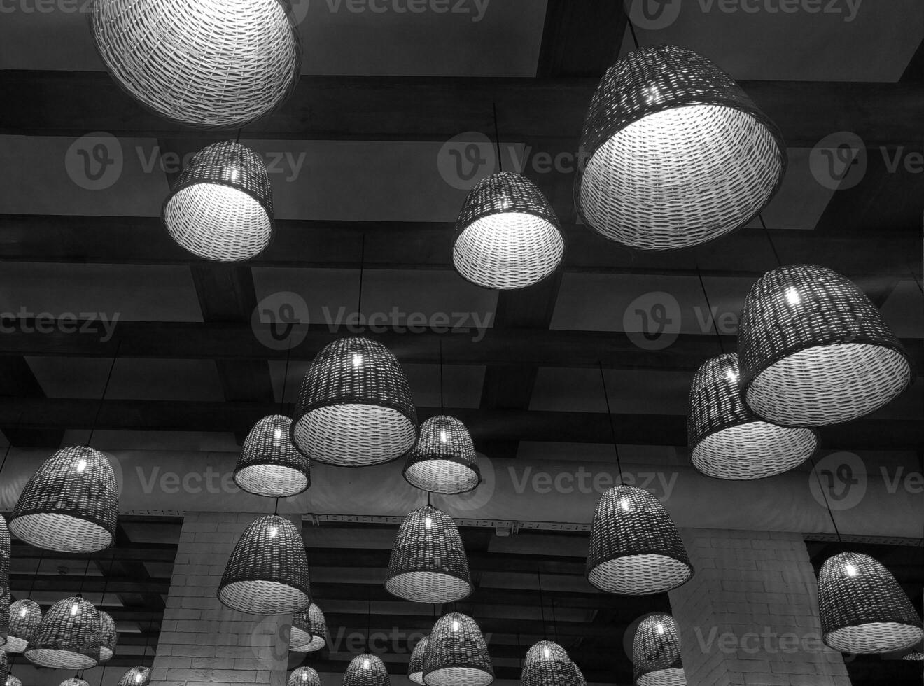 Black and white electric lamps and wooden ceiling background. Monochrome cafe photo wallpaper