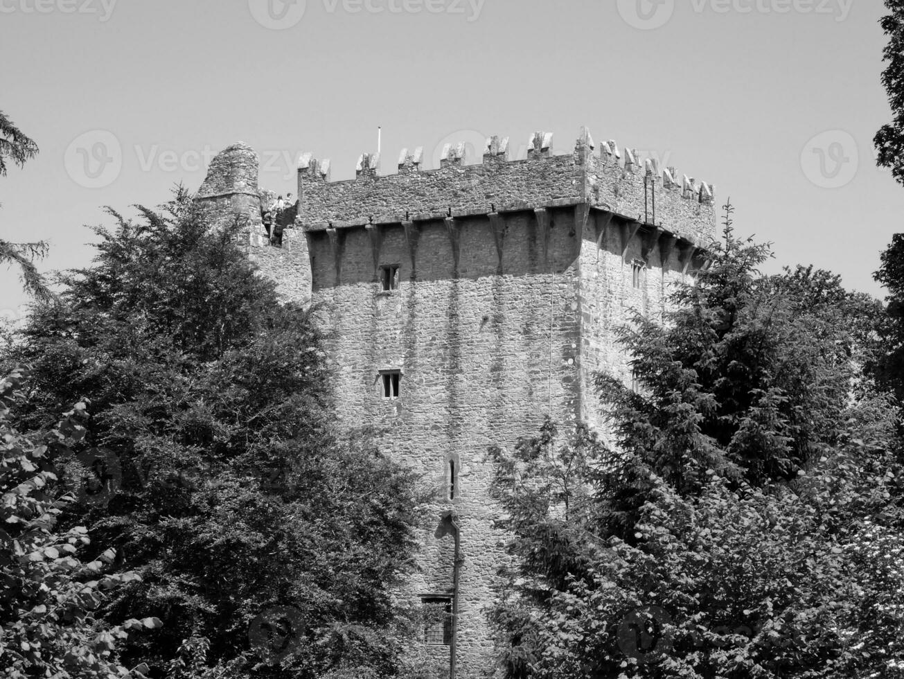 Old celtic castle tower in the trees, Blarney castle in Ireland, old ancient celtic fortress photo