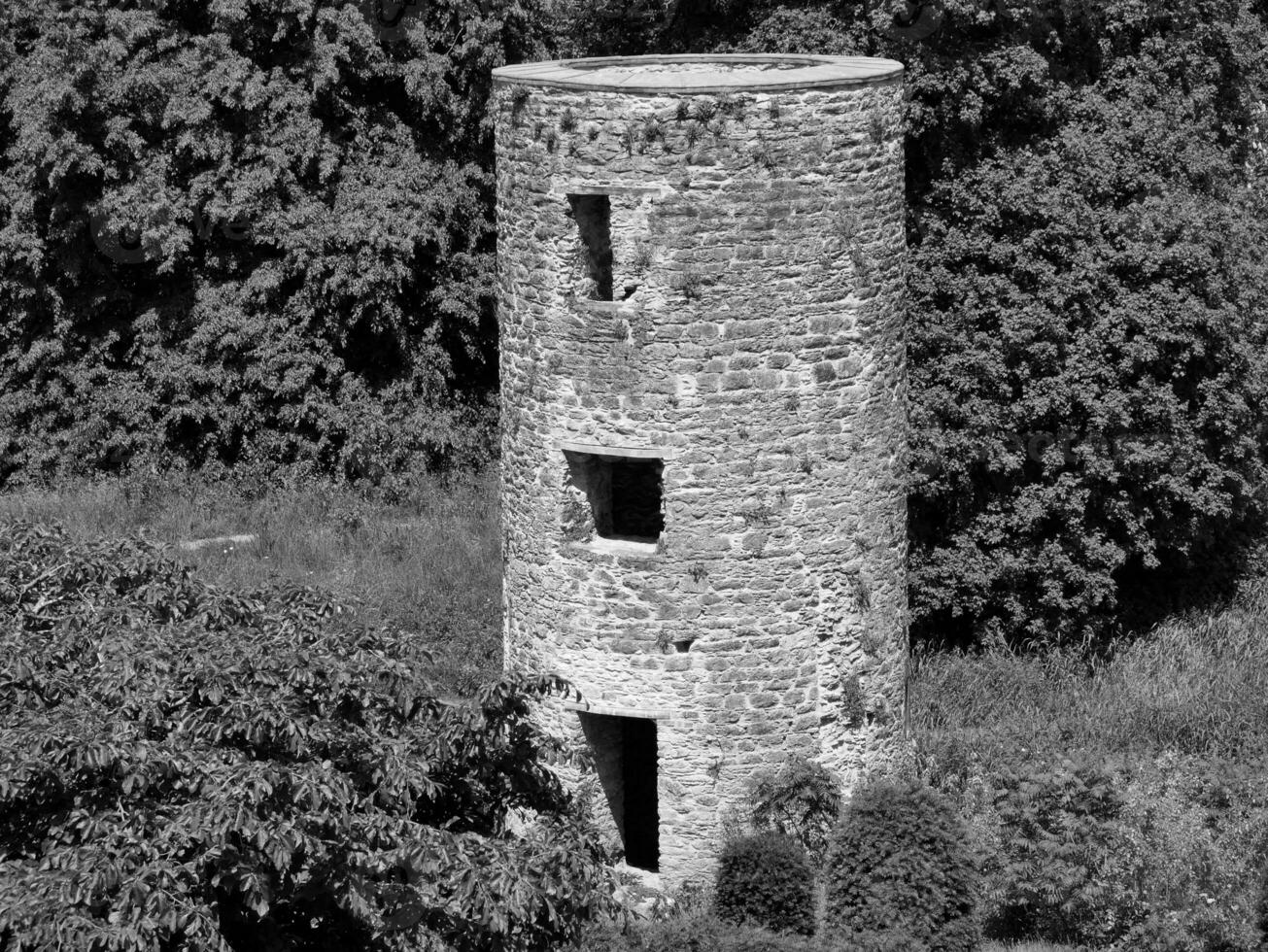 Old celtic castle tower among the trees, Blarney castle in Ireland, old ancient celtic fortress photo