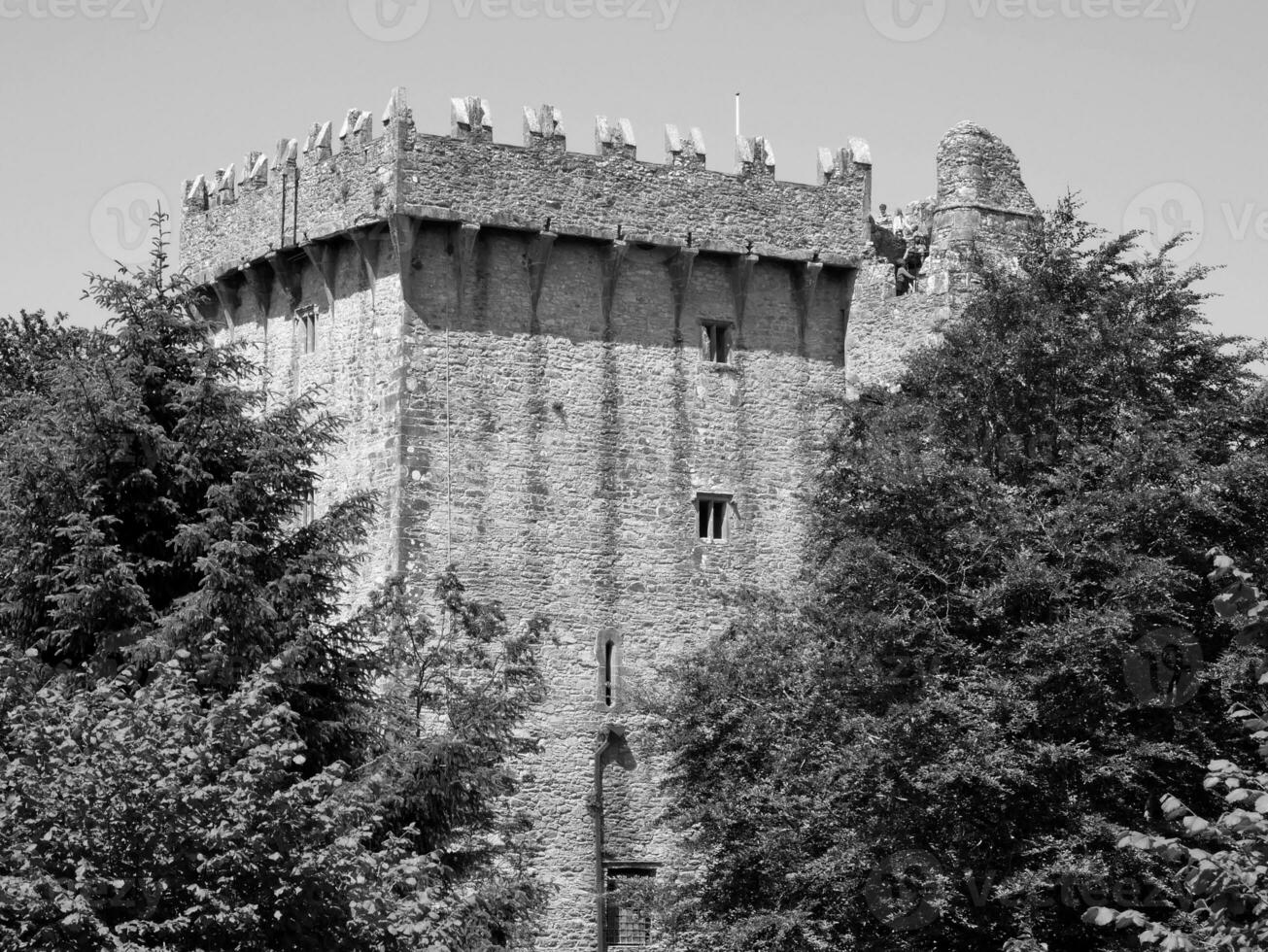Old celtic castle tower in the trees, Blarney castle in Ireland, old ancient celtic fortress photo