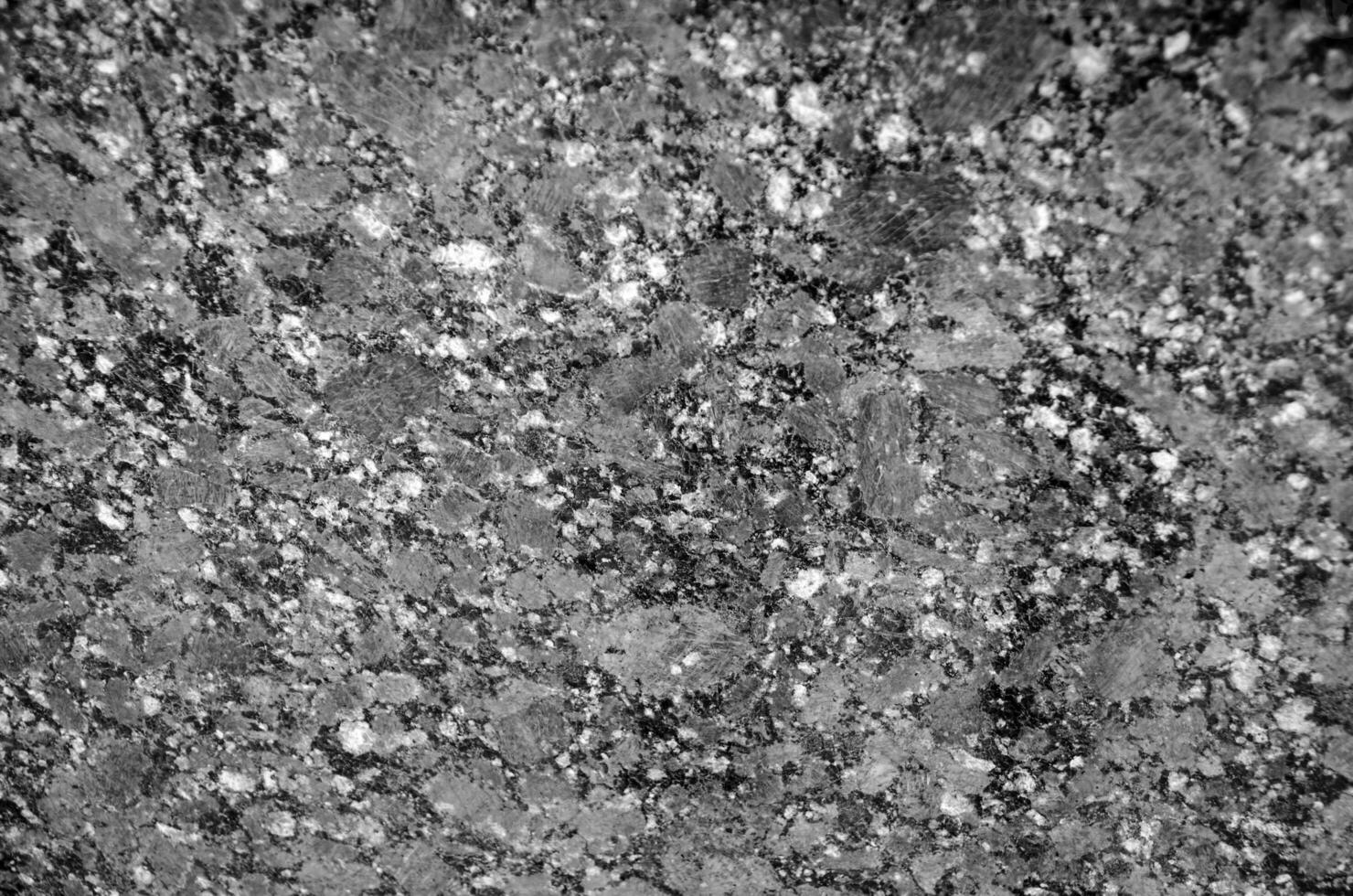 Granite texture close view, natural pattern black and white background photo