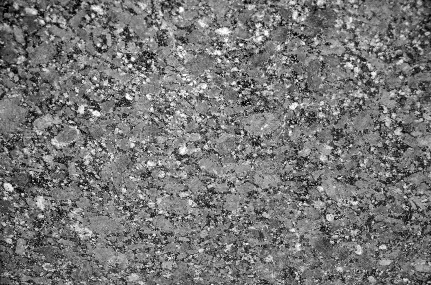 Granite texture close view, natural pattern black and white background photo