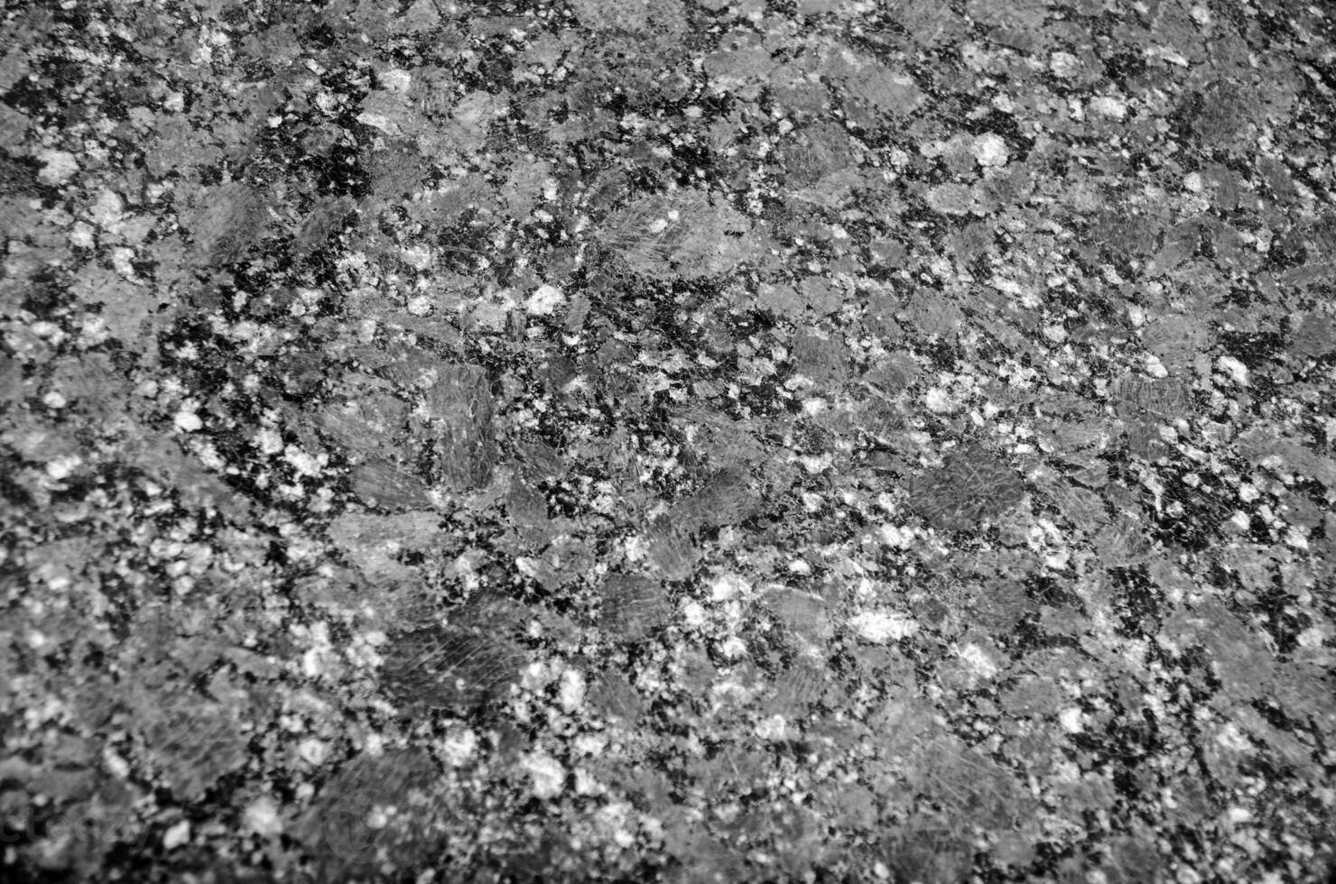 Granite texture close view, natural pattern black and white background photo