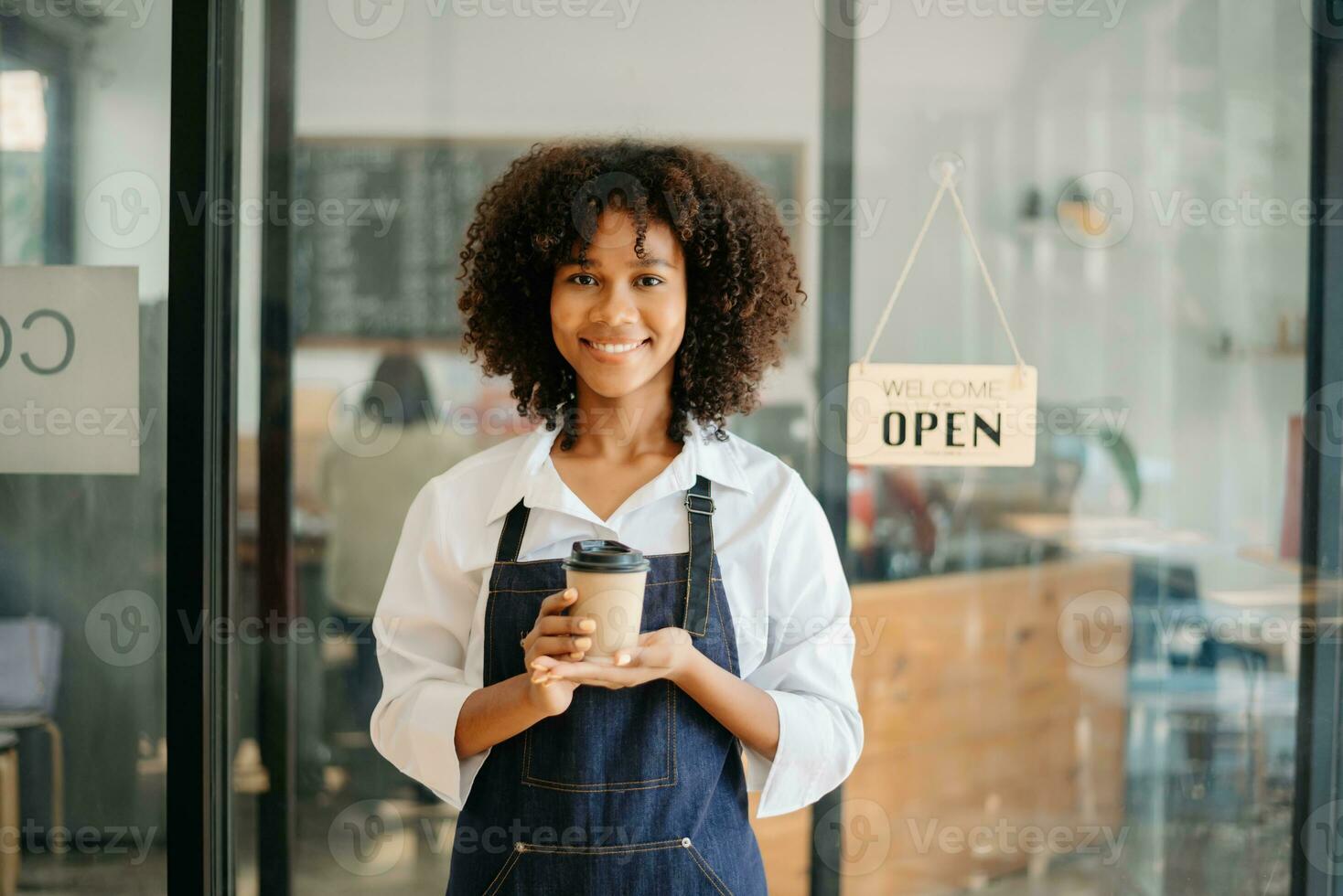 Startup successful small business owner sme woman stand with tablet  in cafe restaurant. woman barista cafe owner. photo