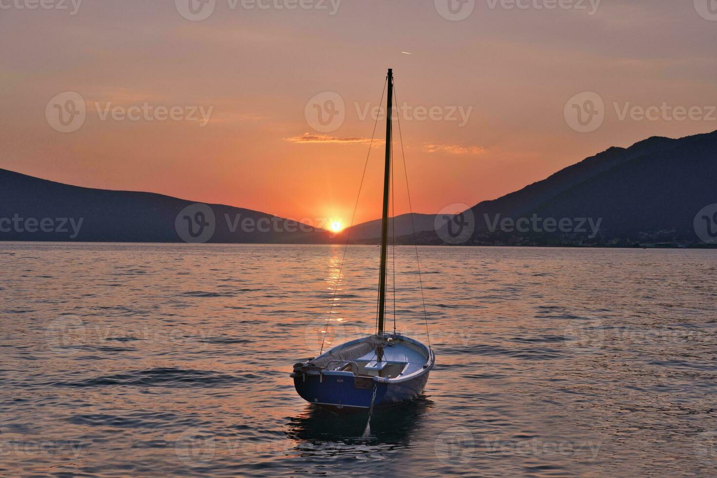 Beautiful sunset with fishing boat photo