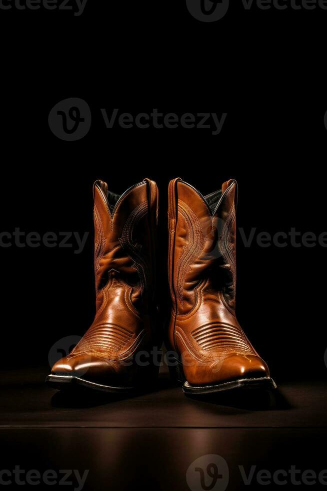 A pair of brown cowboy boots against a dark background.Generative AI photo