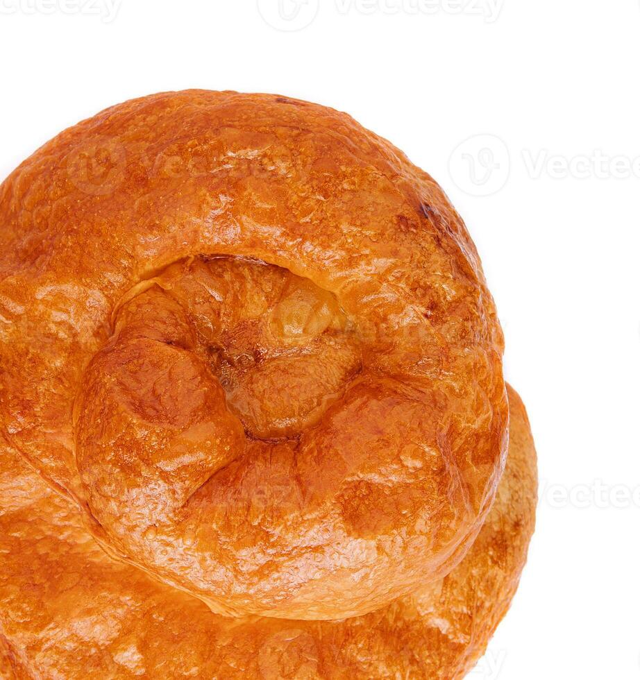 Puff pastry bun rolled up in the form of a snail photo