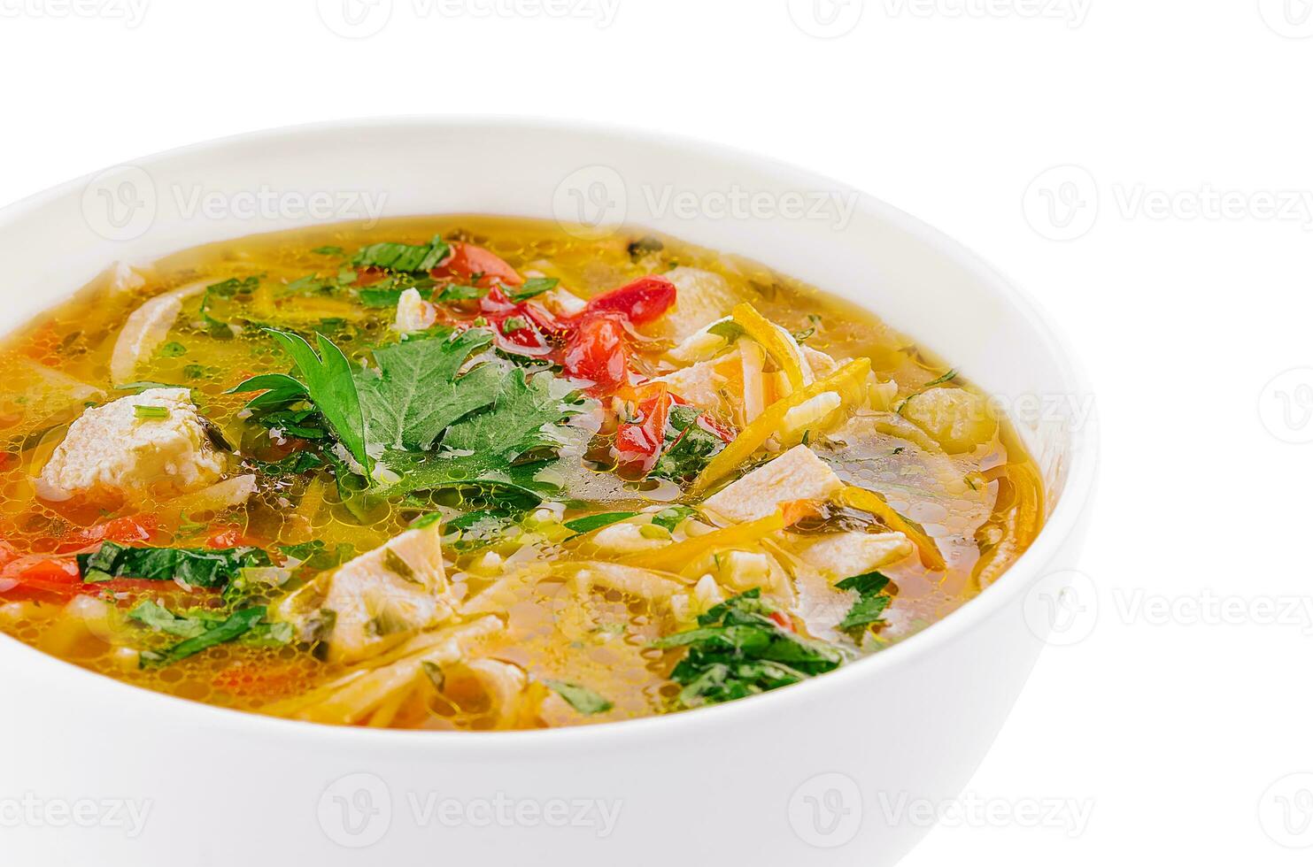 chicken noodle soup in a white ceramic bowl isolated on white photo