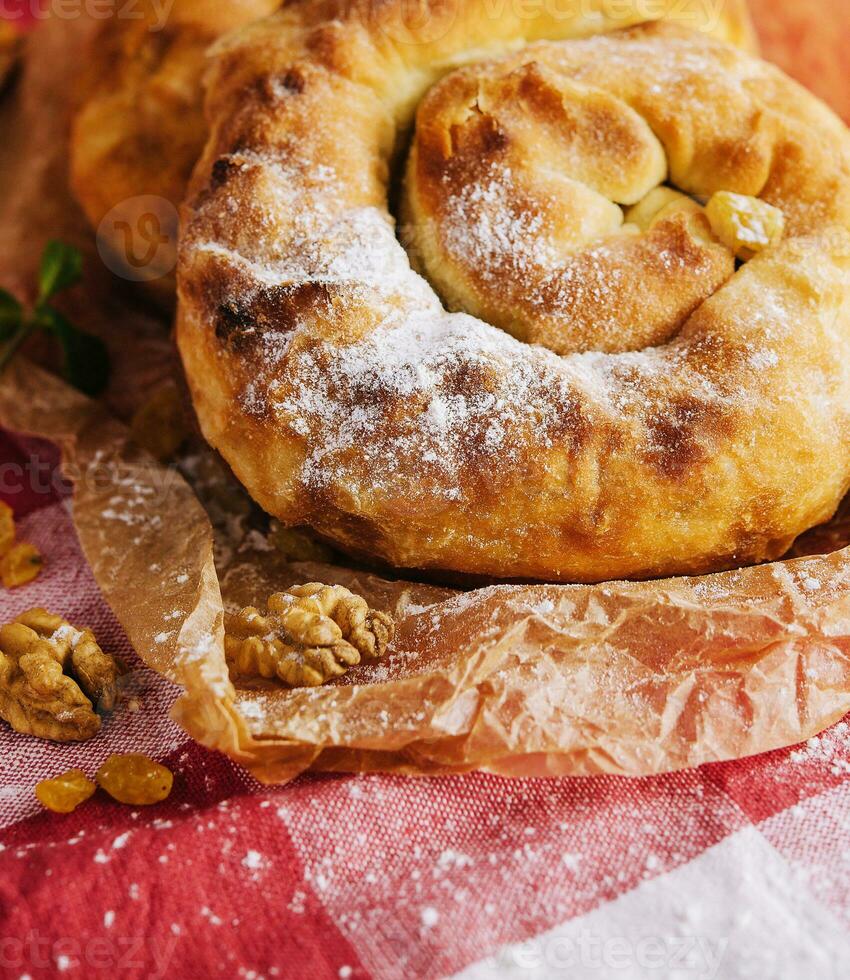 Sweet bun with jam and walnuts photo