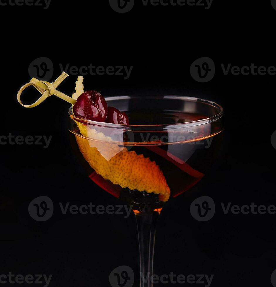 Glass of tasty Negroni cocktail with orange peel photo