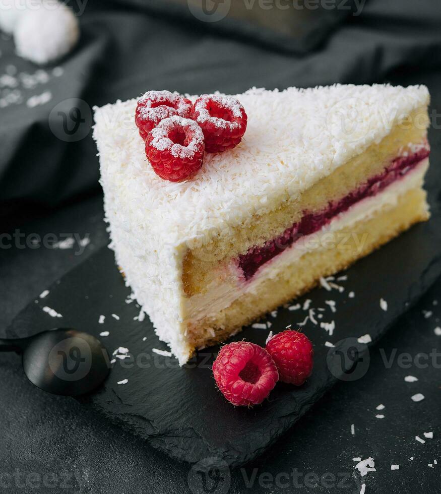 Winter cake with white cream decorated raspberries photo