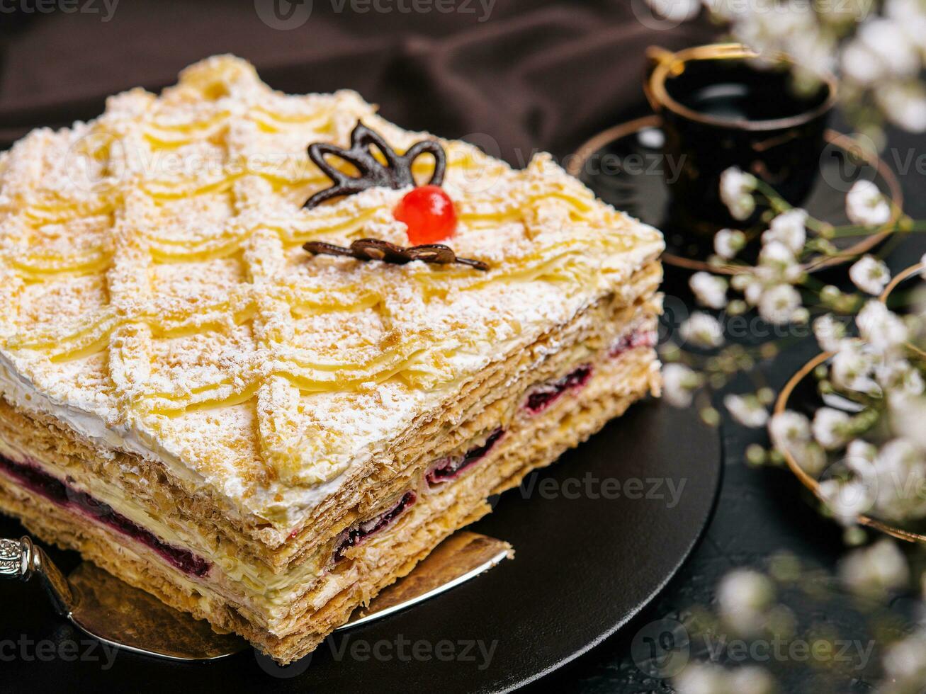 cake with cream cheese filling and cherry photo