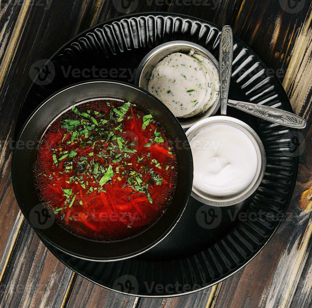 Ukrainian cuisine - borscht with sour cream photo