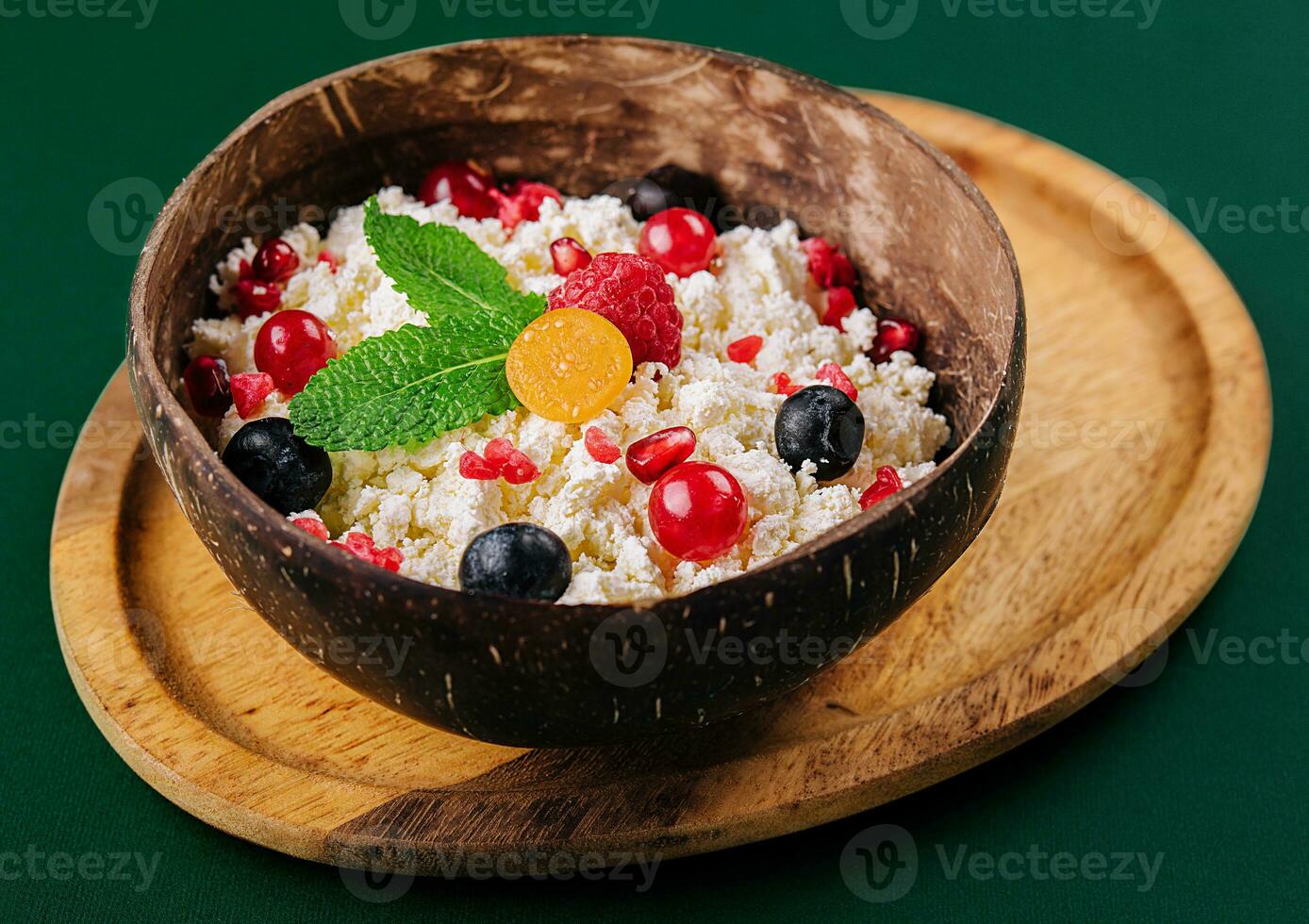 coconut bowl with cottage cheese and ripe berries photo