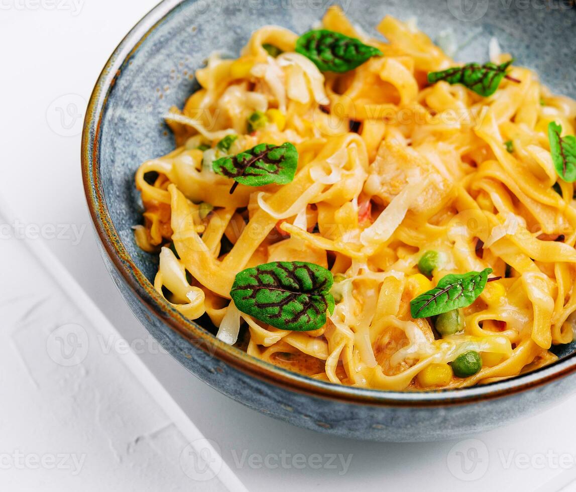 Pasta salad with grilled vegetables peas and corn photo