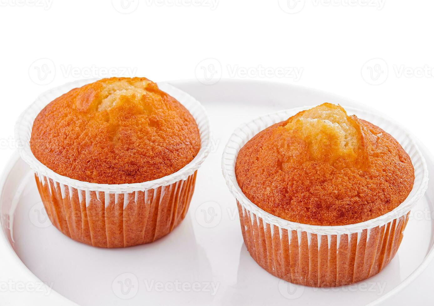 homemade muffins or cupcakes isolated on white background photo