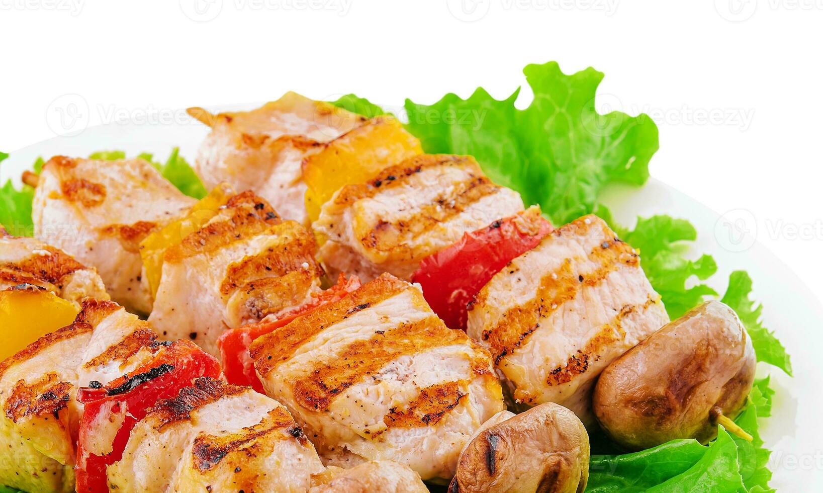 pork skewers with grilled bell peppers and mushrooms photo