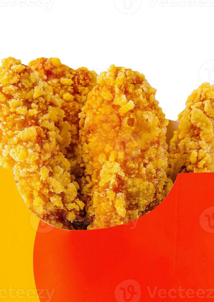 fried chicken nuggets in take out box isolated photo