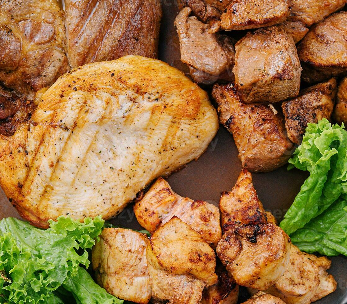 Grilled barbecue meat assortment closeup photo