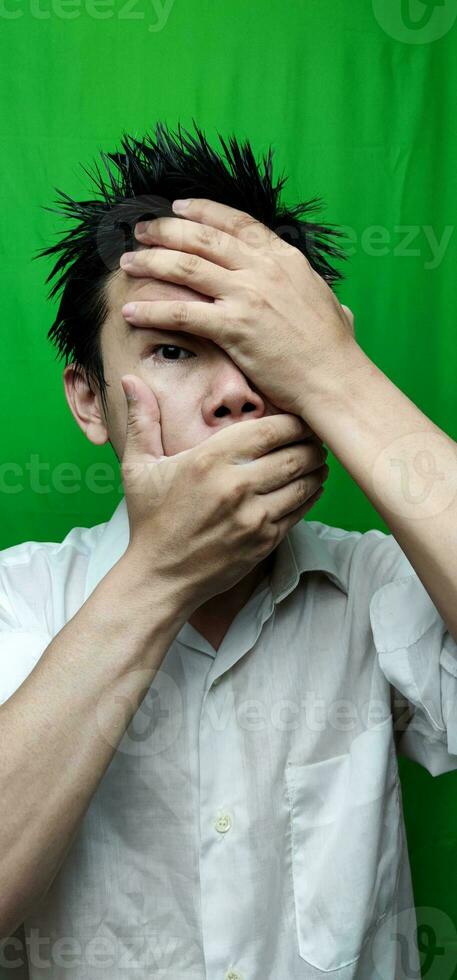 A Man's Expression Reflecting Apprehension and Unease with his Fearful Gaze photo