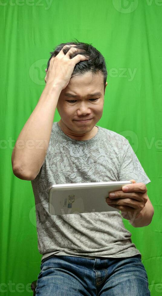 A Man's Expression Reflecting Apprehension and Unease with his Fearful Gaze photo