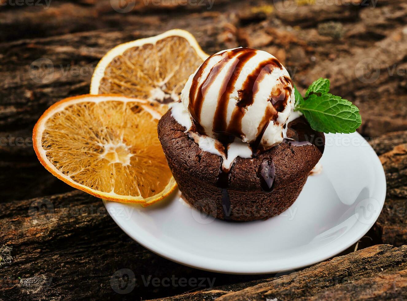 Chocolate fondant cake, molten lava cake with lemon slices photo