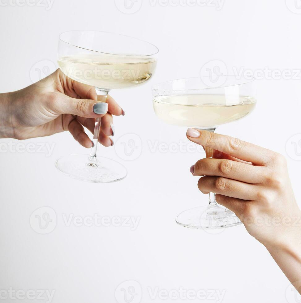 Cheers. Prosecco or white wine in beautiful glasses photo