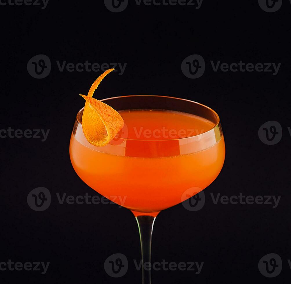 Fresh orange alcoholic drink with orange peel photo