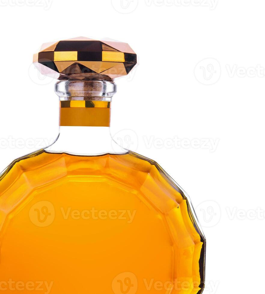 Bottle of cognac isolated on white photo