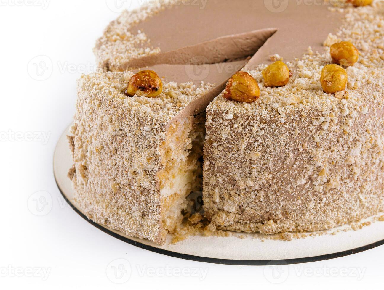 Kiev cake with hazelnut on white plate top view photo