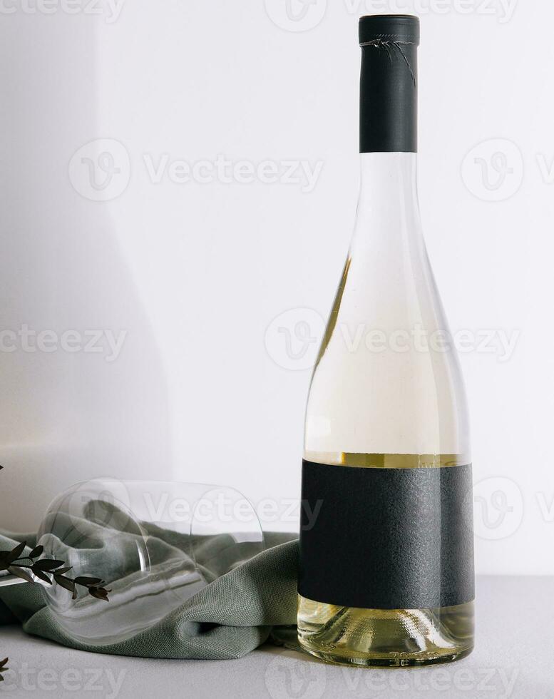 Bottle of white wine with glass photo