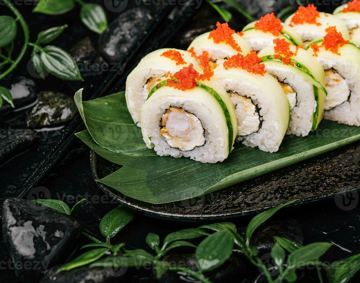 Sushi set with cheese, rice, shrimp and cucumber photo