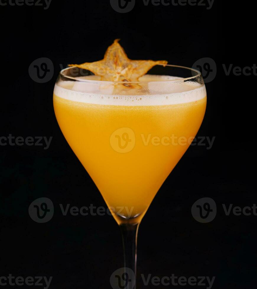 refreshing carambola martini cocktail with champagne photo