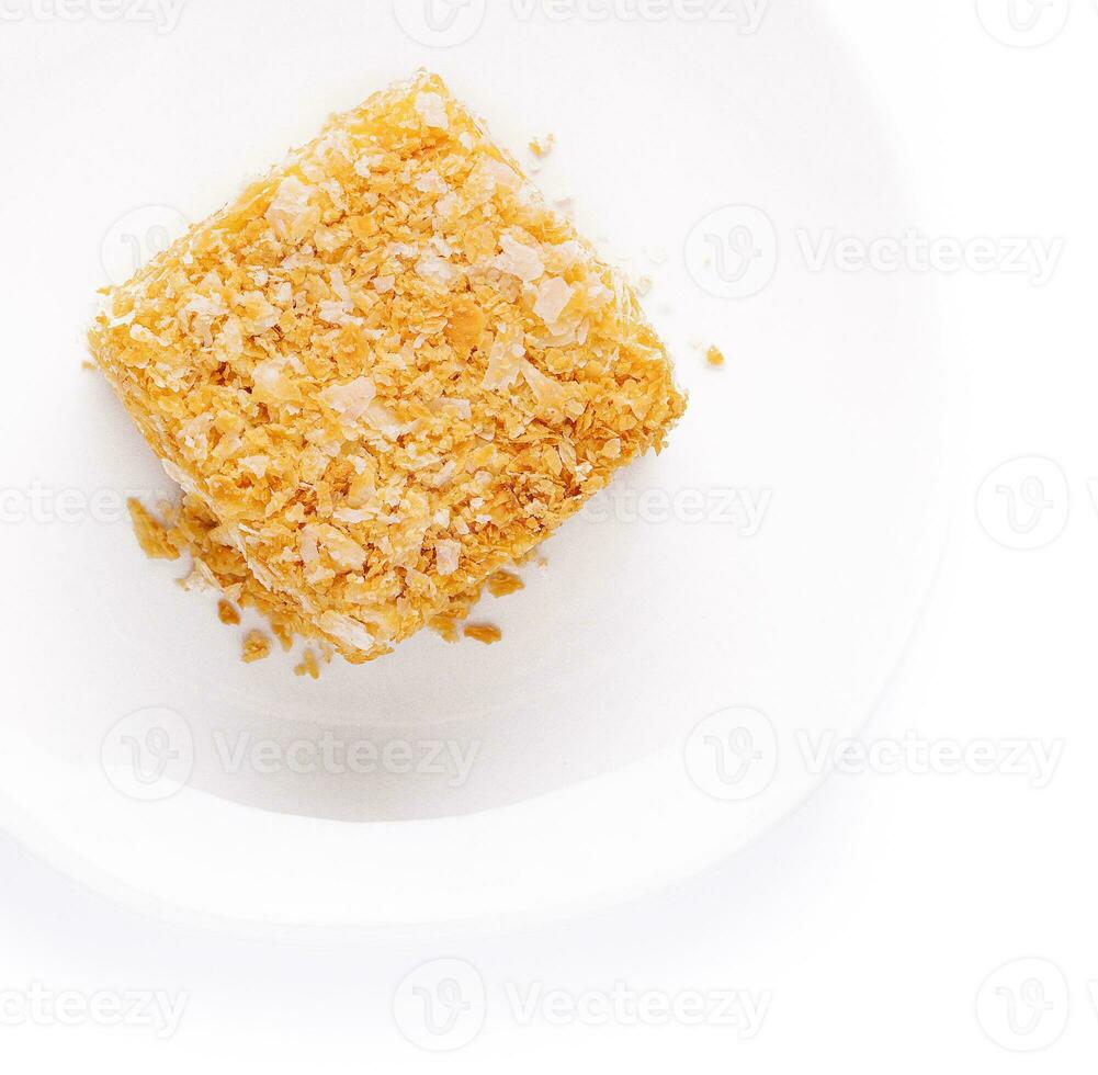 Slice of Napoleon Cake on top view photo