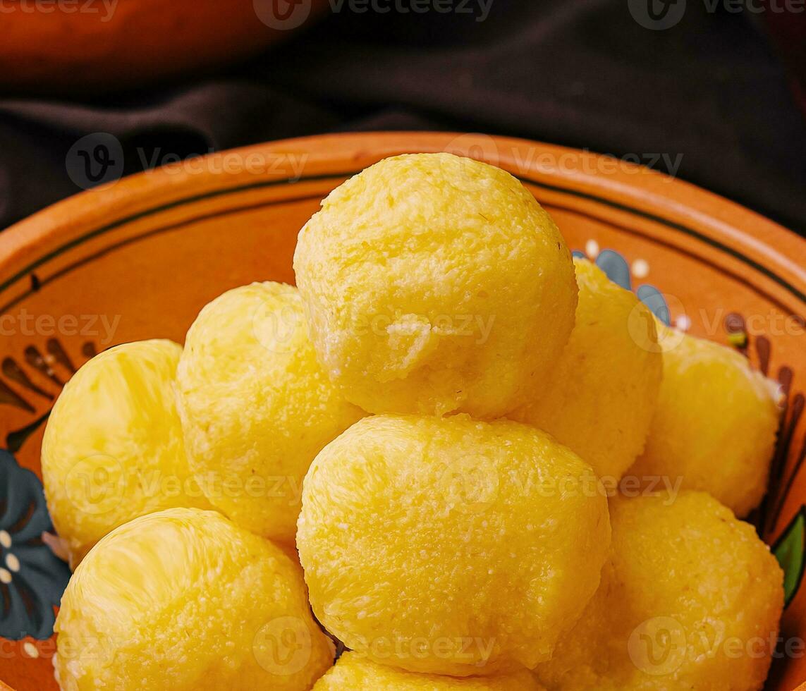 cheese balls with garlic inside in bowl photo