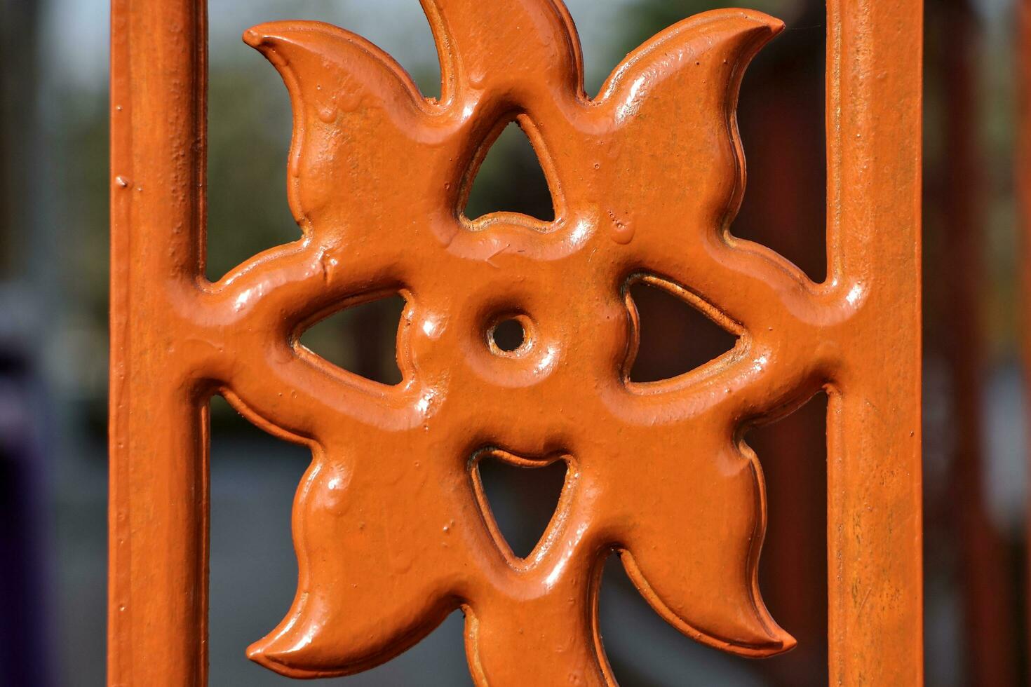 Close-up of a fence carved into the shape of a flower. photo