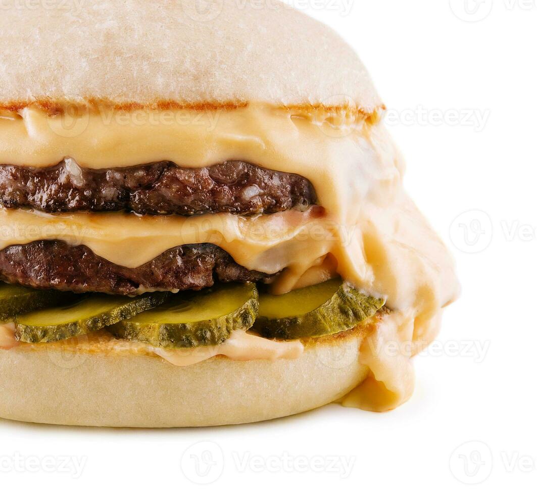 hamburger with two cutlets, pickled cucumbers and melted cheese photo