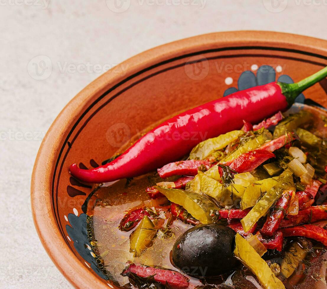 meat soup Solyanka in bowl close up photo