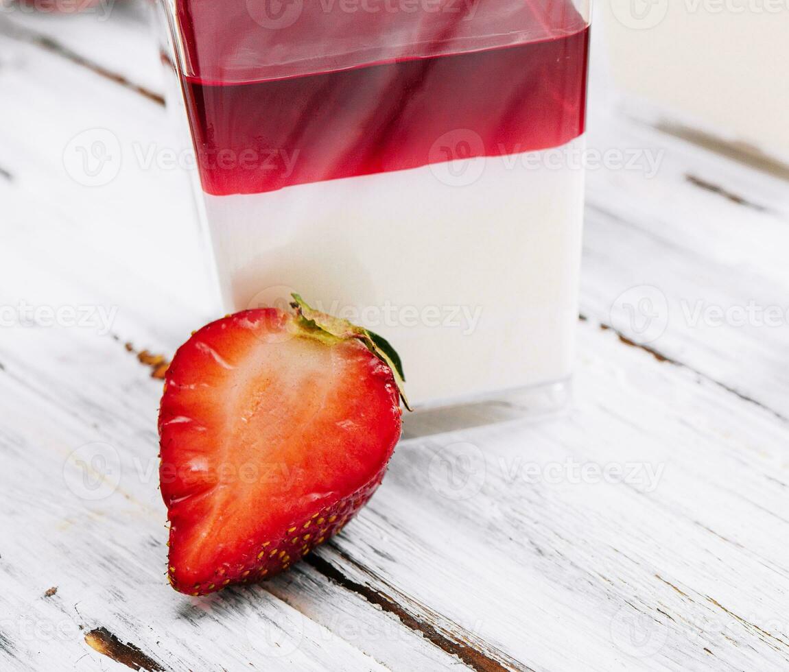 Panna cotta with jelly strawberries, italian dessert photo